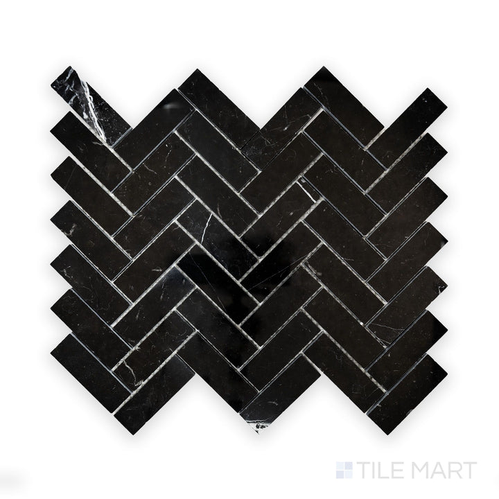 A close-up look at Negro Marquina Marble 1X3 Herringbone Polished Mosaic, showcasing crisp white veining against a deep black polished background.