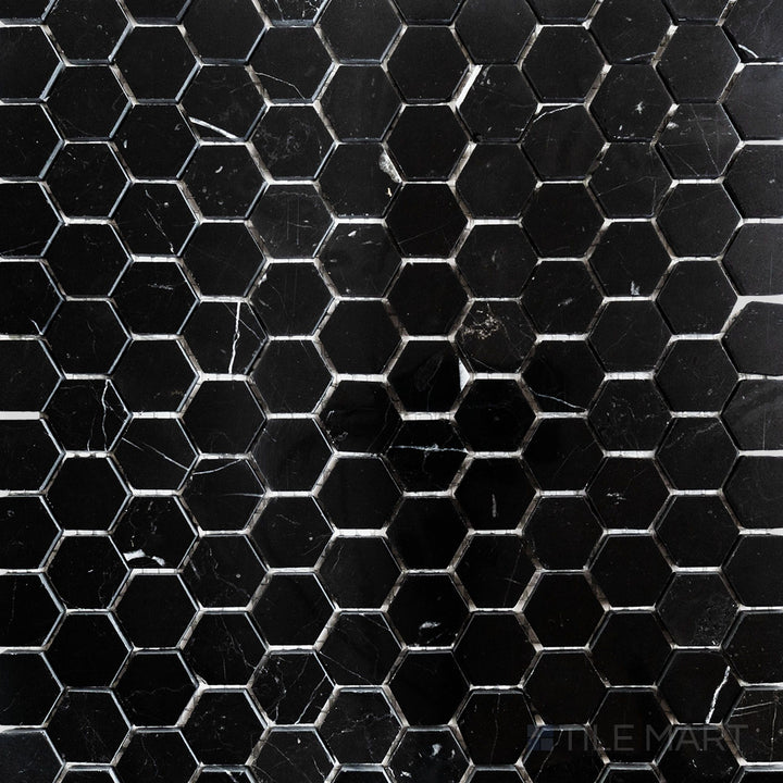 Overhead image of Negro Marquina Marble 1" hexagon polished mosaic, showcasing a luxurious polished finish that reflects light beautifully.