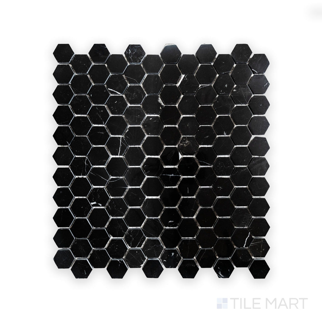 A high-resolution close-up of Negro Marquina Marble 1" Hexagon Polished Mosaic, featuring a sleek black surface with sharp contrasting veins.