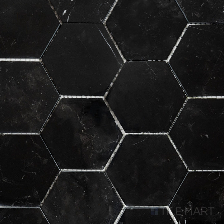 Flat-lay shot of Negro Marquina Marble 3" hexagon polished mosaic, offering a sleek polished surface that enhances its natural veining.