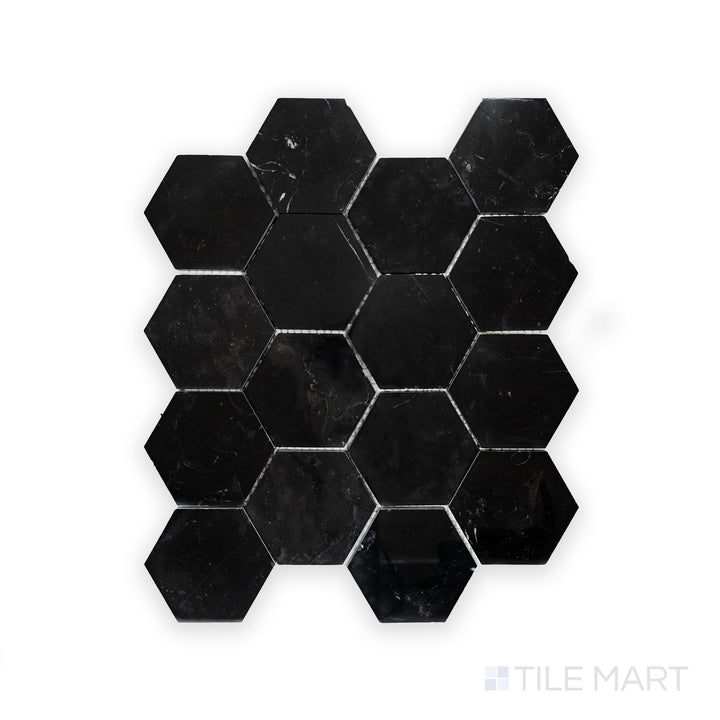 Zoomed-in view of Negro Marquina Marble 3" Hexagon Polished Mosaic, showcasing a dramatic contrast between rich black and striking white veins.