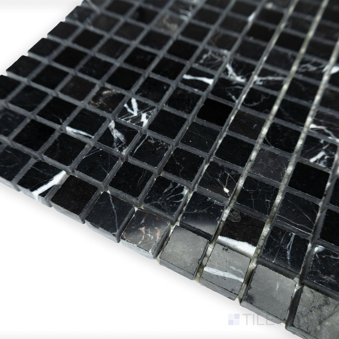 A crisp and polished square arrangement stands out in this corner shot of Negro Marquina Marble 5/8" square polished mosaic, reflecting light beautifully.