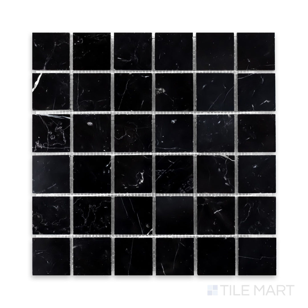 A zoomed-in view of Negro Marquina Marble 2" Square Honed Mosaic, capturing its bold monochrome beauty in a matte finish.