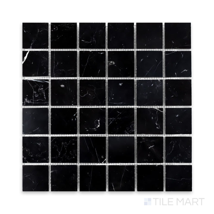 A zoomed-in view of Negro Marquina Marble 2" Square Honed Mosaic, capturing its bold monochrome beauty in a matte finish.