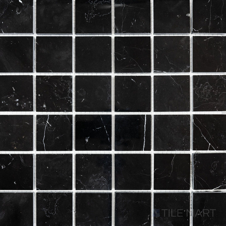 Overhead image of Negro Marquina Marble 2" square polished mosaic, featuring a high-gloss polished surface that enhances the contrast between black and white veining.
