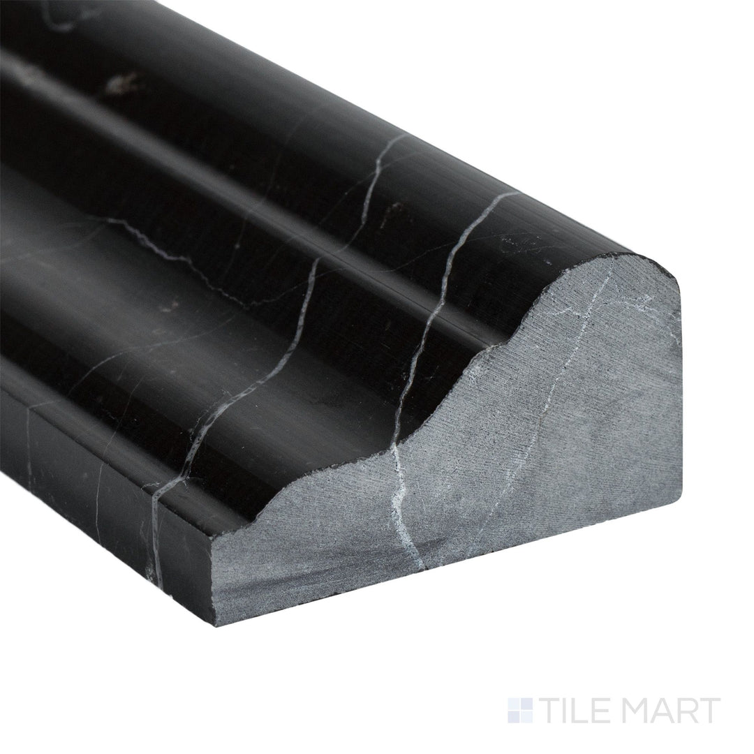 Corner close-up of Negro Marquina Marble 2x12 polished grand chair rail showing deep black tone and glossy veining.