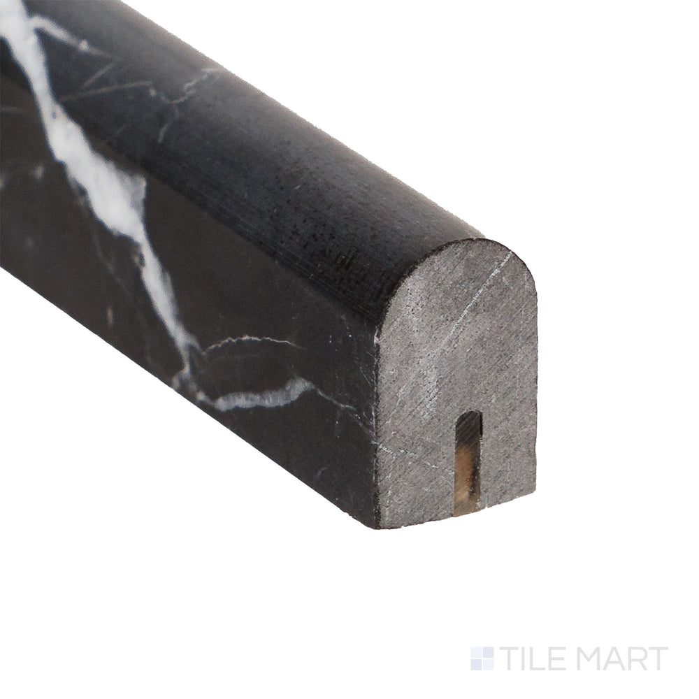 Corner detail of Negro Marquina Marble 0.5x12 honed mini liner highlighting soft matte texture and fine linear edge.