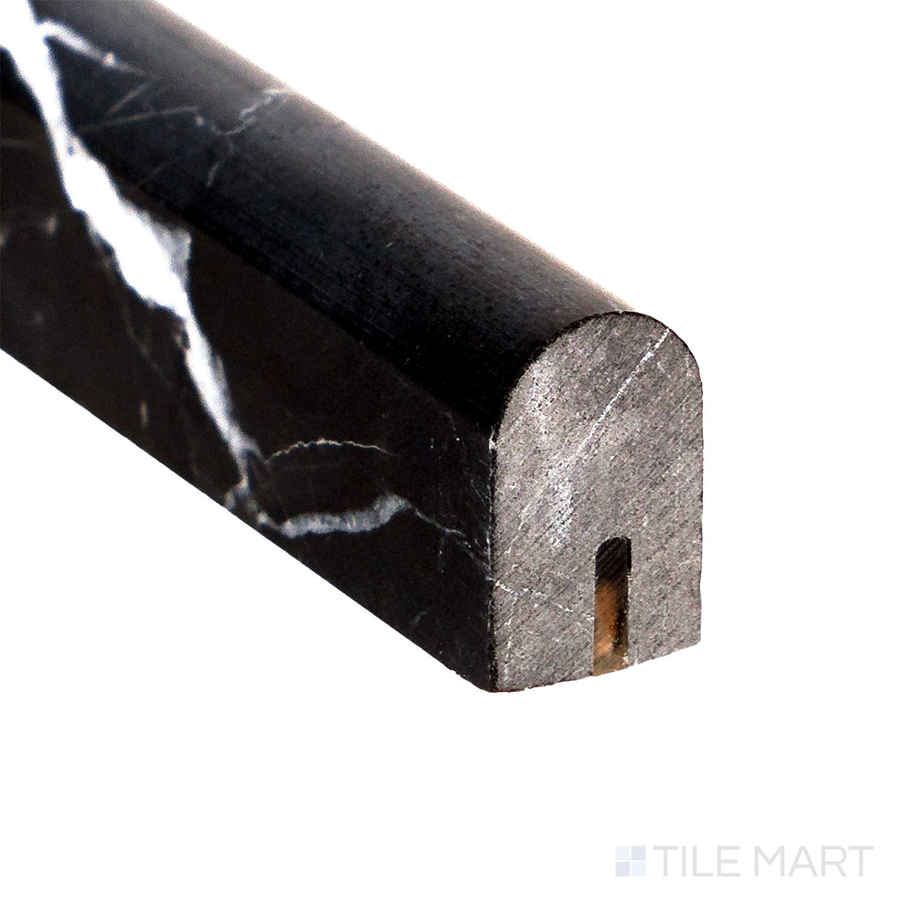 Corner close-up of Negro Marquina Marble 0.5x12 honed mini liner showing deep tone and smooth honed surface.