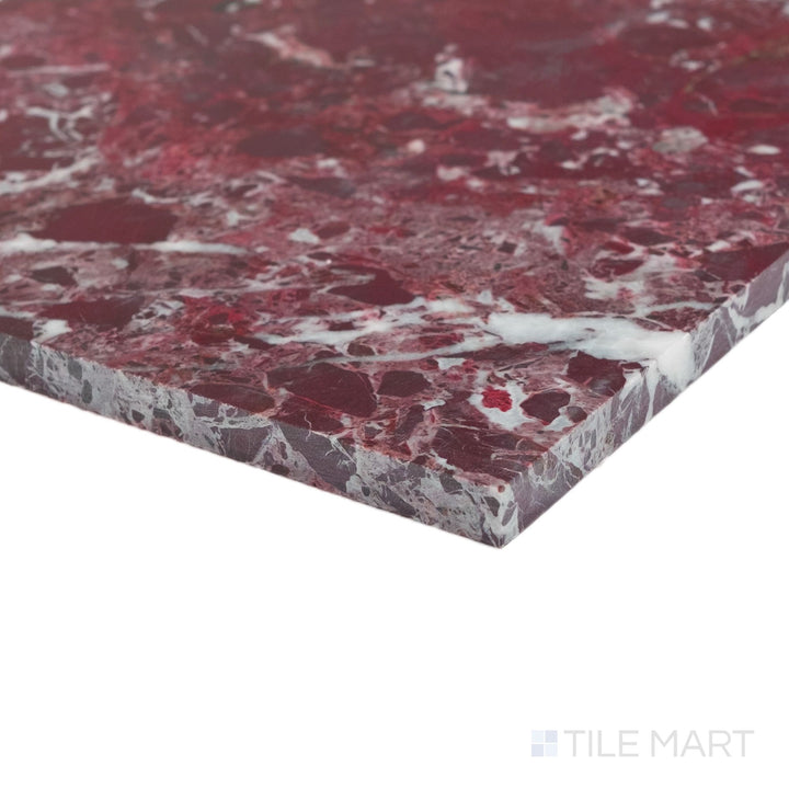 Corner detail of polished Rosso Levanto marble 12x12 tile showcasing rich veining and reflective surface