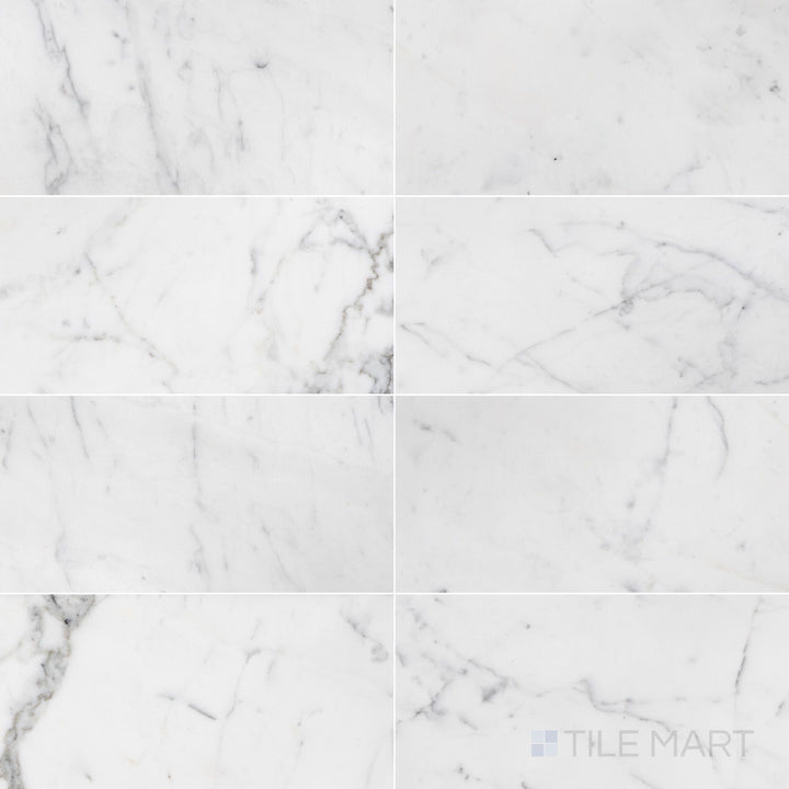 Overhead image of Statuary White Marble 12x24 honed tile, showcasing a classic white marble with soft grey veining and a smooth honed texture.
