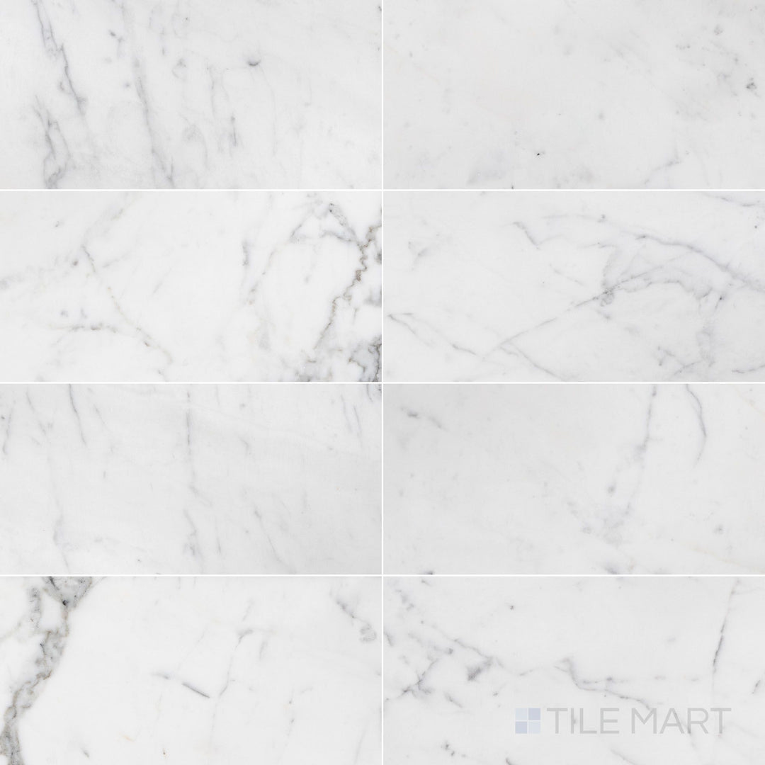 Overhead image of Statuary White Marble 12x24 honed tile, showcasing a classic white marble with soft grey veining and a smooth honed texture.