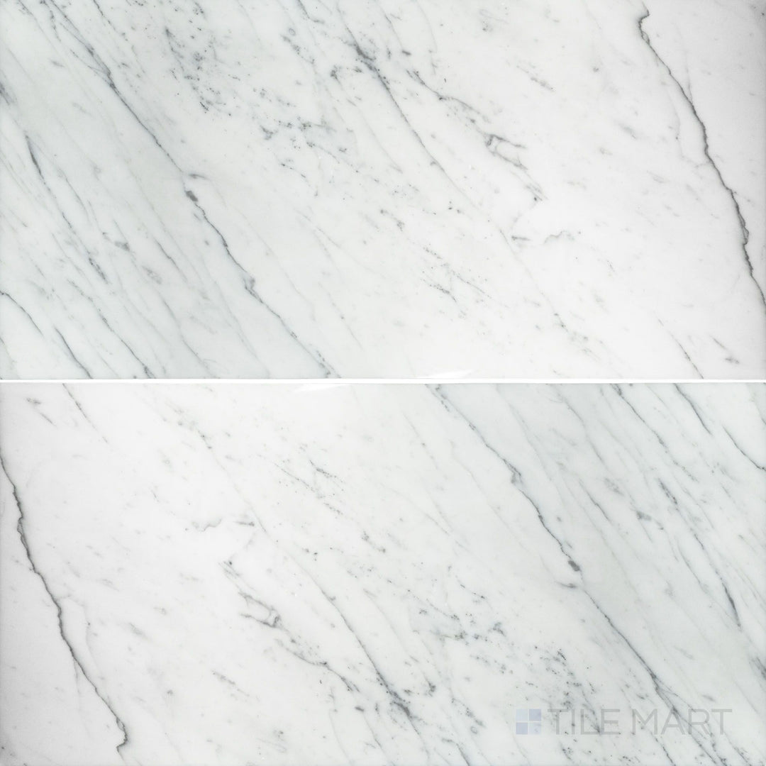 Flat-lay shot of Statuary White Marble 12x24 polished tile, offering a high-gloss finish that highlights the elegant white marble and subtle veining.