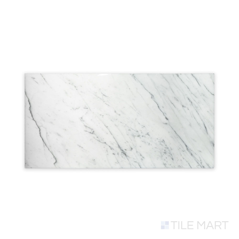 Close-up of Statuary White Marble 12X24 Polished, featuring a crisp white background with bold, fluid gray veining.