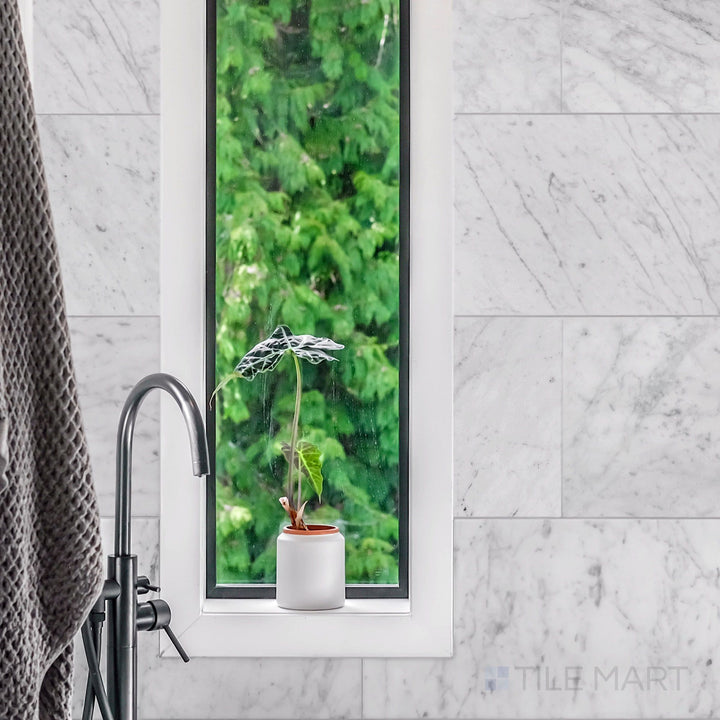 Sleek and timeless atmosphere styled with White Carrara Marble 3X6 Honed