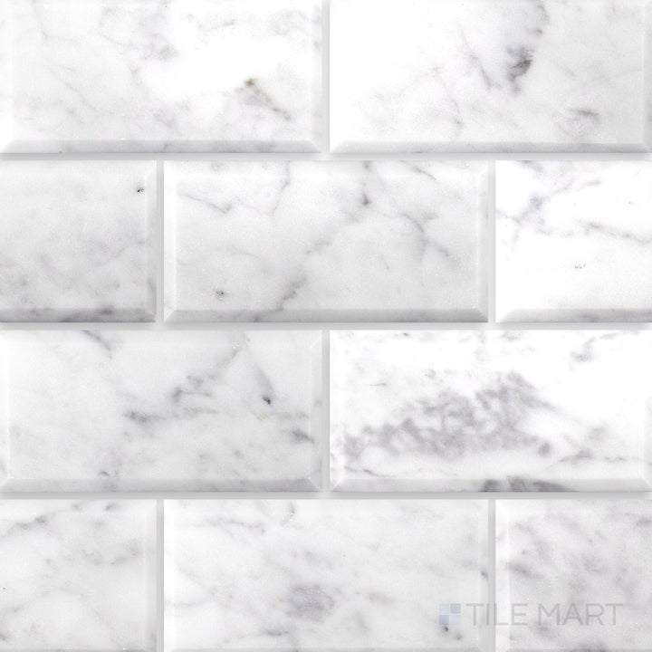 Flat lay of White Carrara Marble 3x6 beveled polished tile showcasing crisp beveled edges with a bright, glossy marble surface