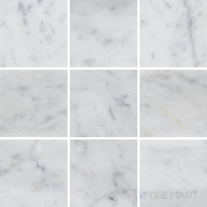 Top-down image of White Carrara Marble 4x4 honed tile, featuring smooth matte marble squares for versatile wall and floor designs