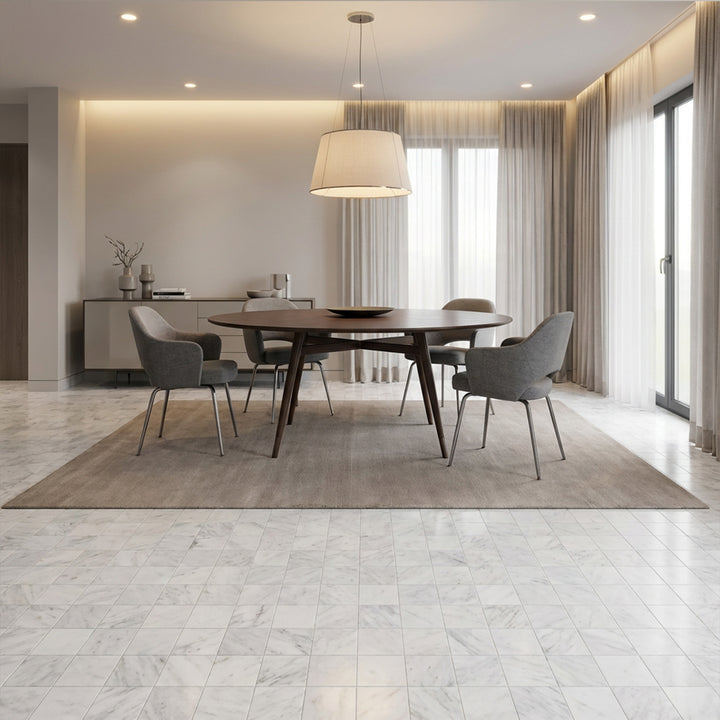 White Carrara marble 4x4 tumbled tile displayed in a clean setting highlighting natural variation