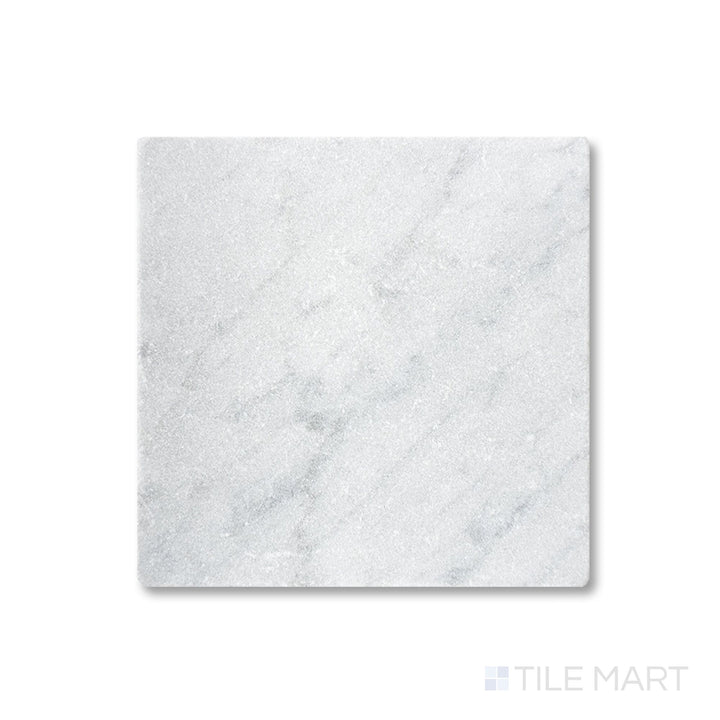 Full view from above of White Carrara Marble 4x4 tumbled tile displaying textured marble squares with a rustic natural look