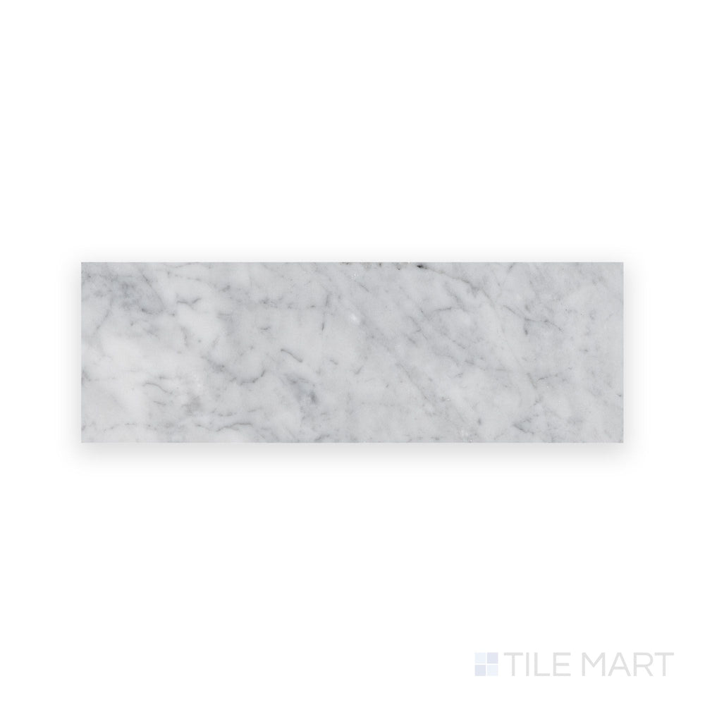 Overview of White Carrara Marble 4x12 honed tile showing long matte marble tiles perfect for sleek, extended layouts