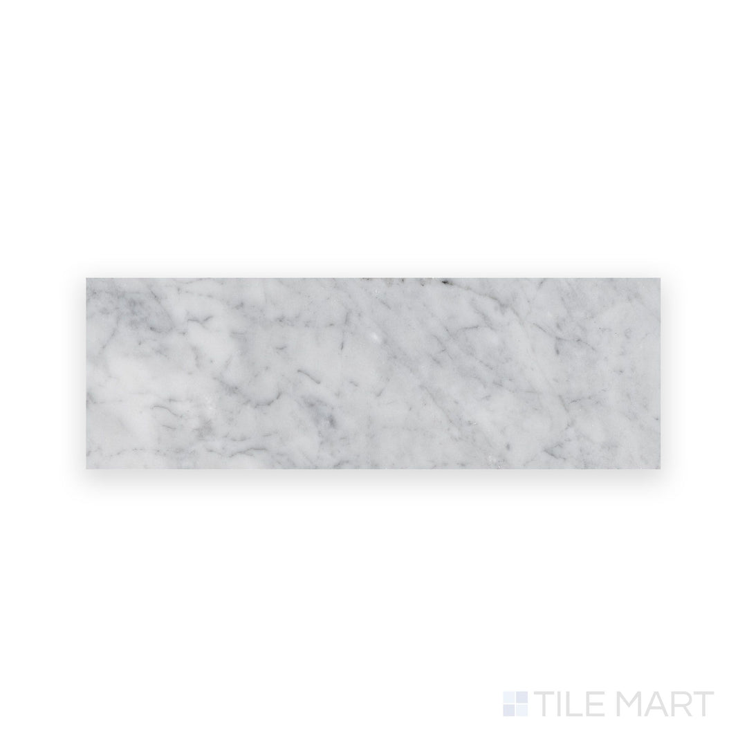 Overview of White Carrara Marble 4x12 honed tile showing long matte marble tiles perfect for sleek, extended layouts