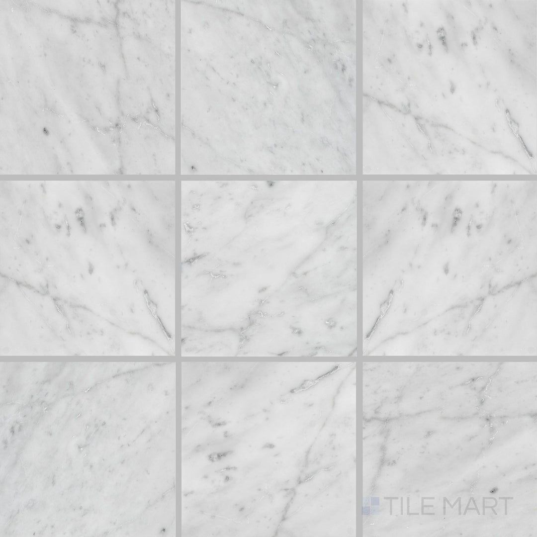 Overhead shot of White Carrara Marble 6x6 polished tile featuring mid-size marble squares with a reflective, luxurious surface