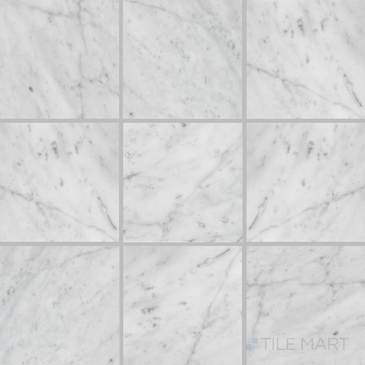 Overhead shot of White Carrara Marble 6x6 polished tile featuring mid-size marble squares with a reflective, luxurious surface
