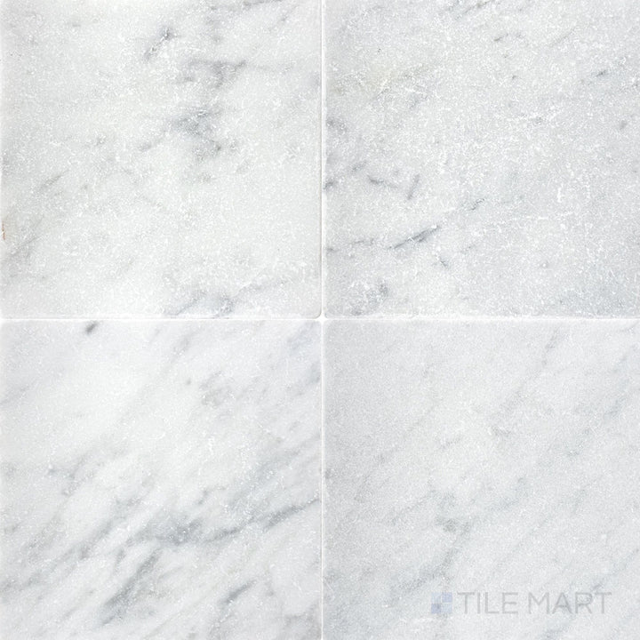 Tumbled White Carrara marble 6x6 tile showcasing subtle veining and natural variation