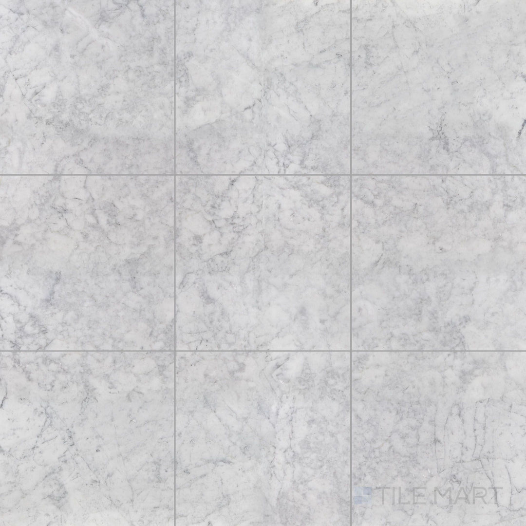 Top view of White Carrara Marble 12x12 honed tile, showing expansive matte marble squares designed for spacious and timeless settings