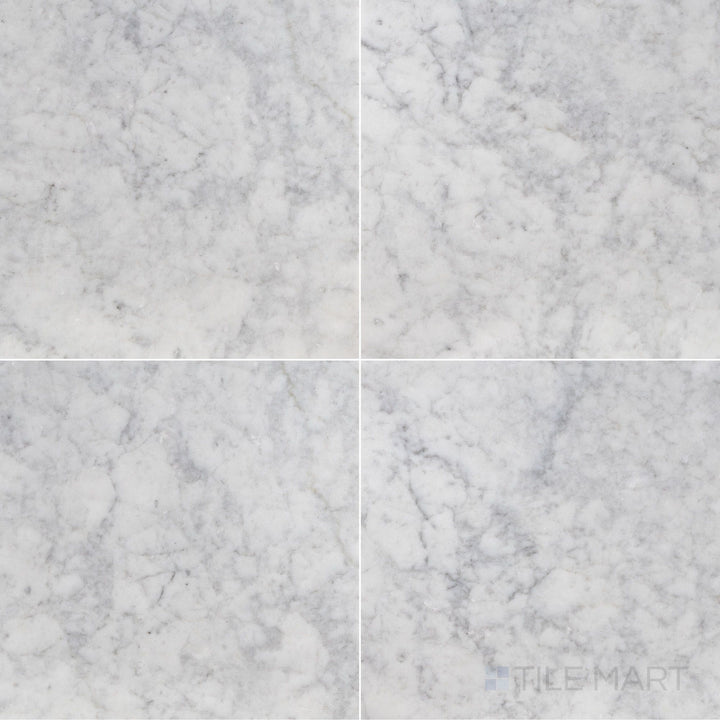 Overhead shot of White Carrara Marble 18x18 honed tile, offering expansive matte marble squares suited for elegant spaces