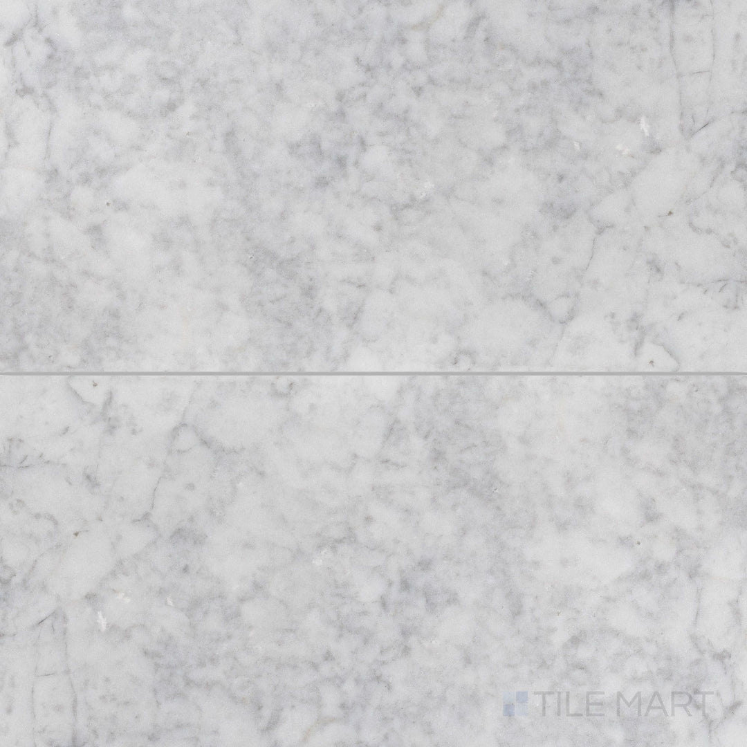 Top-down image of White Carrara Marble 18x36 honed tile featuring large-format marble with a soft textured finish for open, airy designs