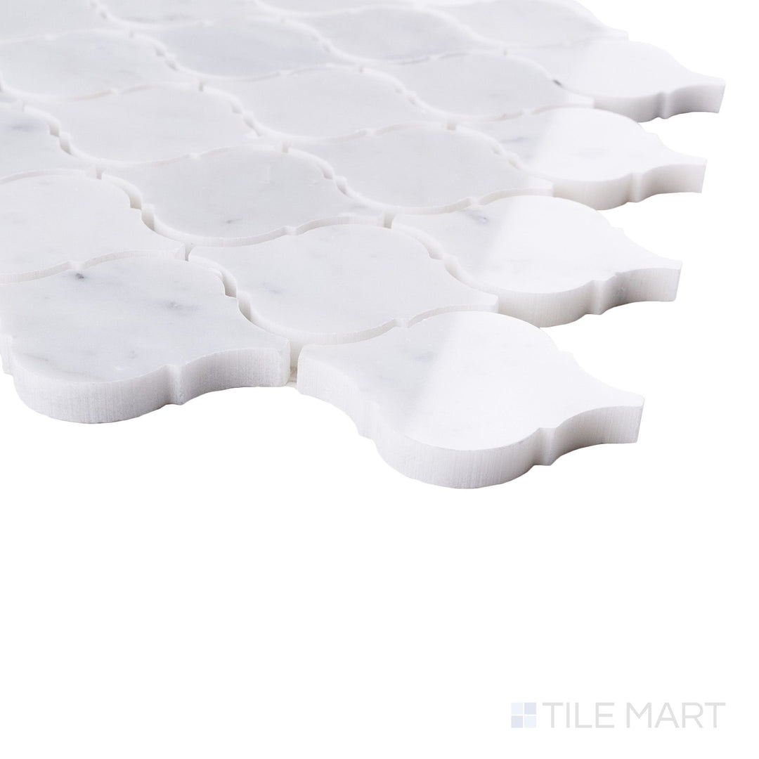 Tile corner display of White Carrara Marble 3" arabesque polished mosaic featuring glossy marble curves and bright finish