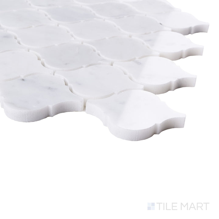 Tile corner display of White Carrara Marble 3" arabesque polished mosaic featuring glossy marble curves and bright finish