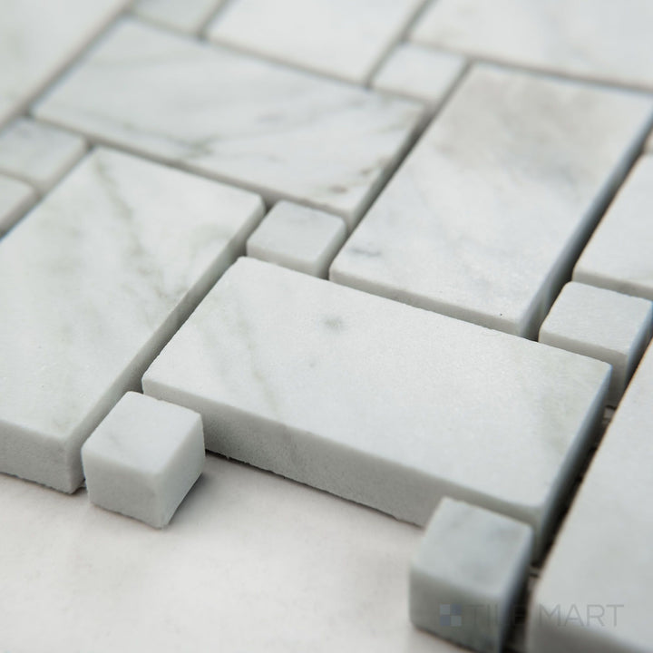Tile corner display of White Carrara Marble basketweave with white dot honed mosaic featuring matte marble and bright accents