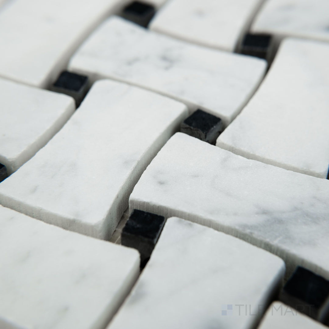 Tile shown from corner angle of White Carrara Marble dogbone basketweave honed mosaic revealing textured marble and elegant dogbone pattern