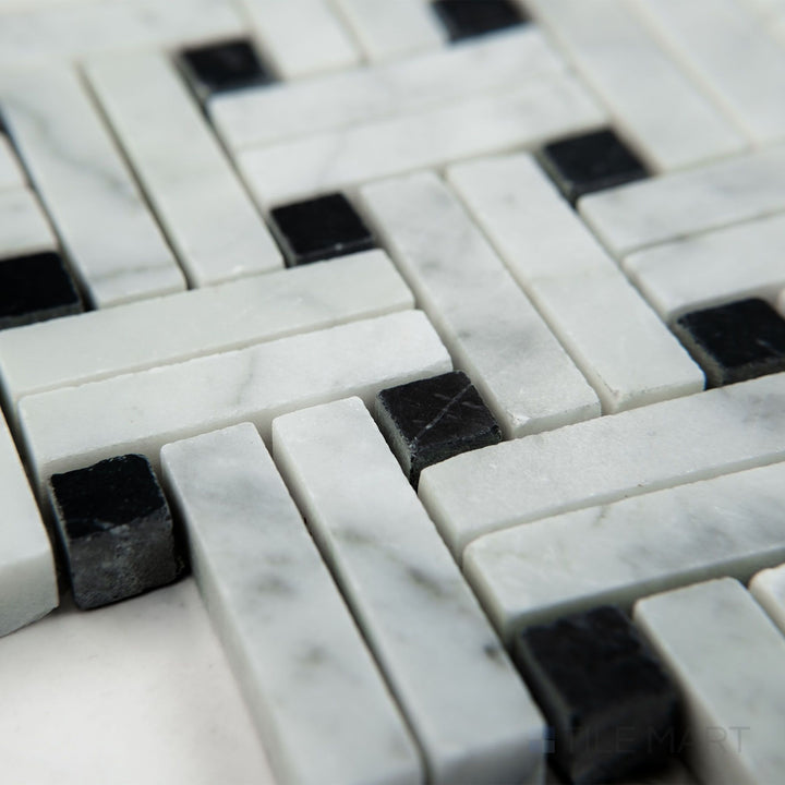 Angled view of White Carrara Marble stanza with Negro Marquina honed mosaic highlighting matte marble with dark stone accents
