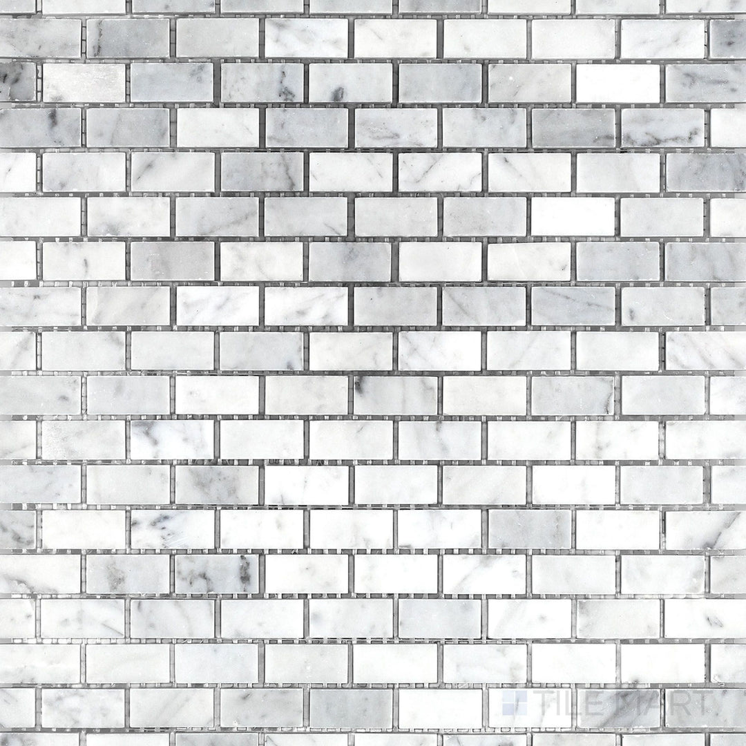 Top view of White Carrara Marble 5/8x1-1/4 brick honed mosaic featuring small rectangular tiles with a soft matte finish for subtle textured surfaces