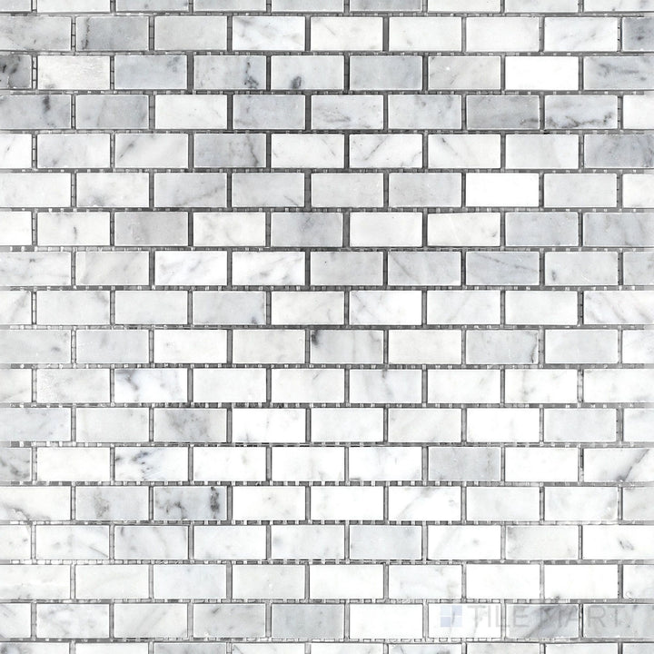 Top view of White Carrara Marble 5/8x1-1/4 brick honed mosaic featuring small rectangular tiles with a soft matte finish for subtle textured surfaces