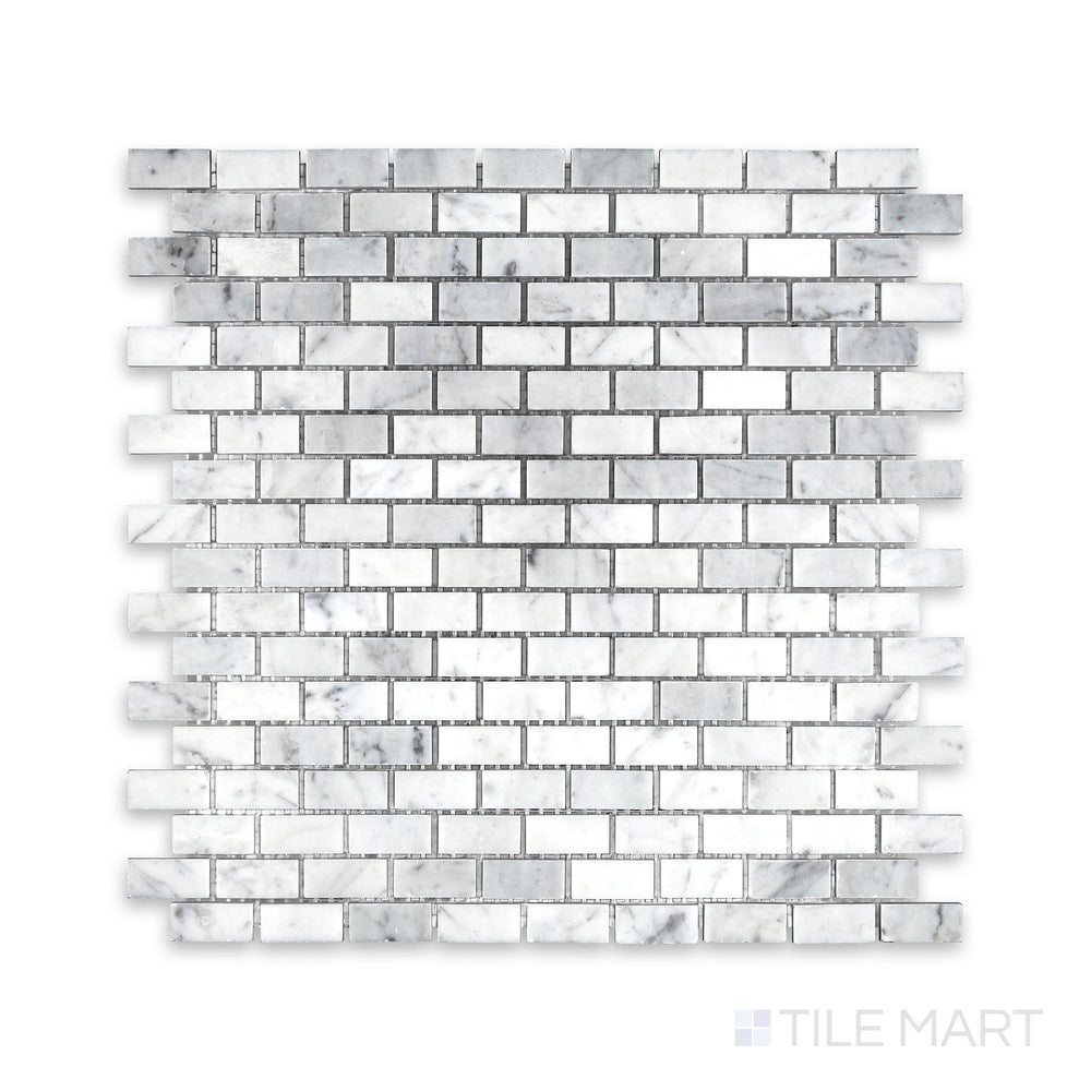Tile arrangement of White Carrara Marble 5/8x1-1/4 brick honed mosaic showing soft-textured rectangular marble pieces in a clean brick layout
