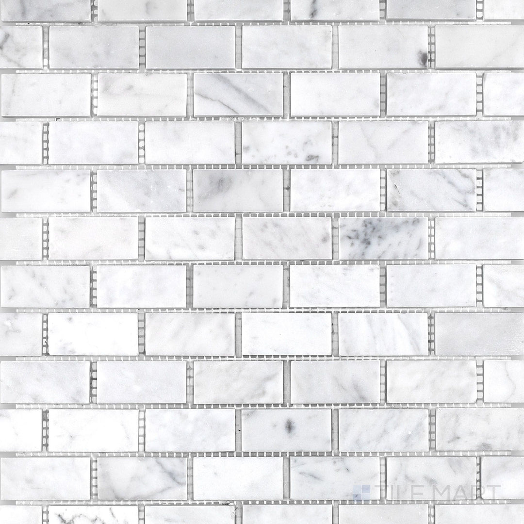 Top-down image of White Carrara Marble 1x2 brick honed mosaic, highlighting a clean matte texture perfect for understated wall or floor designs