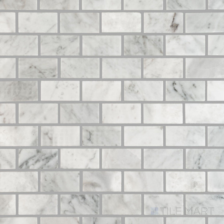 Overhead perspective of White Carrara Marble 1x2 brick polished mosaic with glossy rectangular tiles creating a crisp, modern surface finish