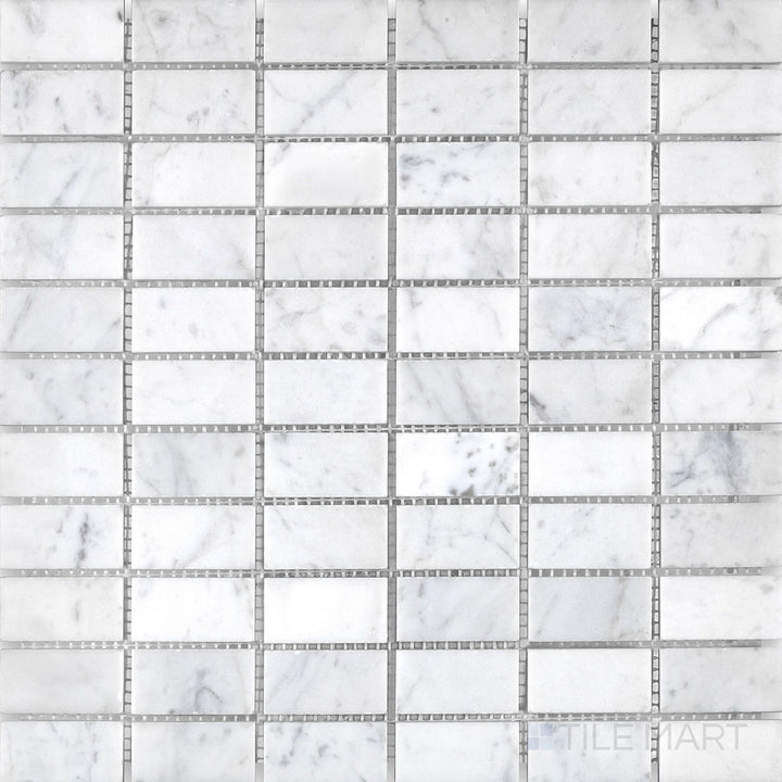 Top-down view of White Carrara Marble stacked honed mosaic tile, showcasing a clean linear arrangement with a soft matte finish for modern walls