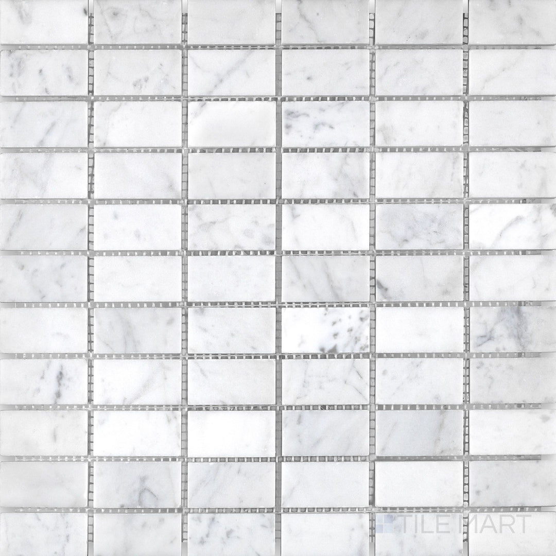 Overview of White Carrara marble stacked polished mosaic, showcasing sleek rectangular tiles with elegant grey veining and a clean polished finish.