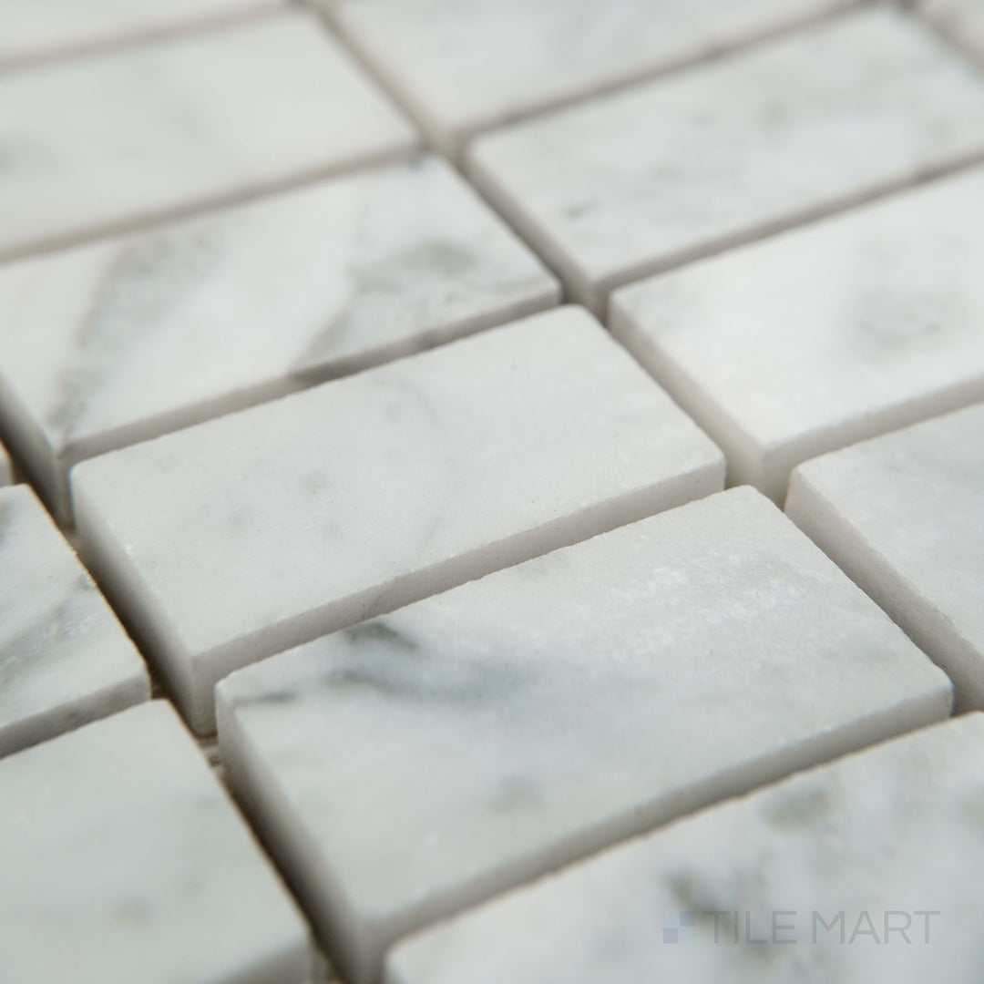 Corner detail of White Carrara Marble stacked polished mosaic highlighting clean lines and glossy white finish.