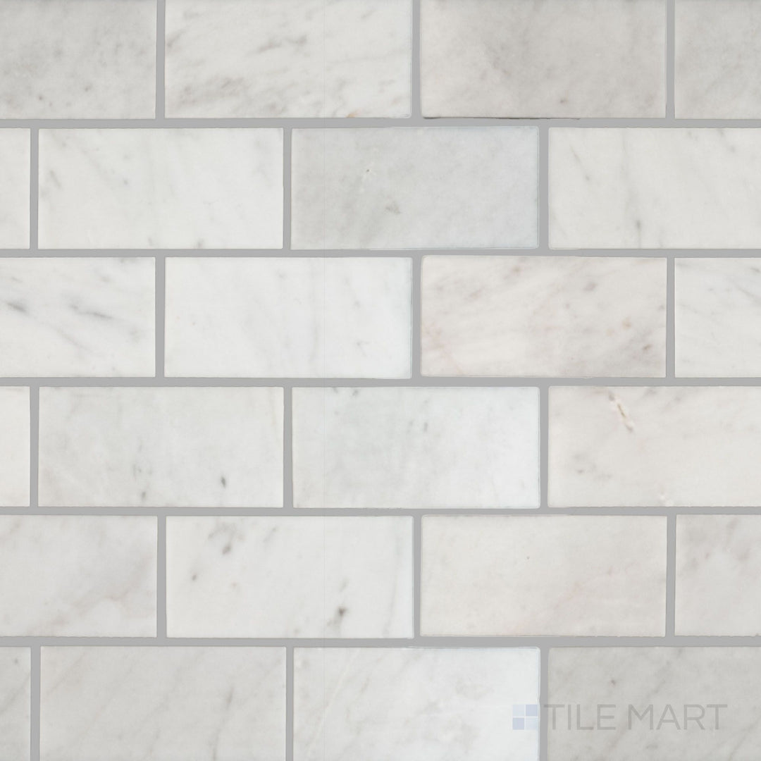 Flat overhead image of White Carrara Marble 2x4 brick polished mosaic, featuring bright glossy rectangles arranged in a classic stacked pattern