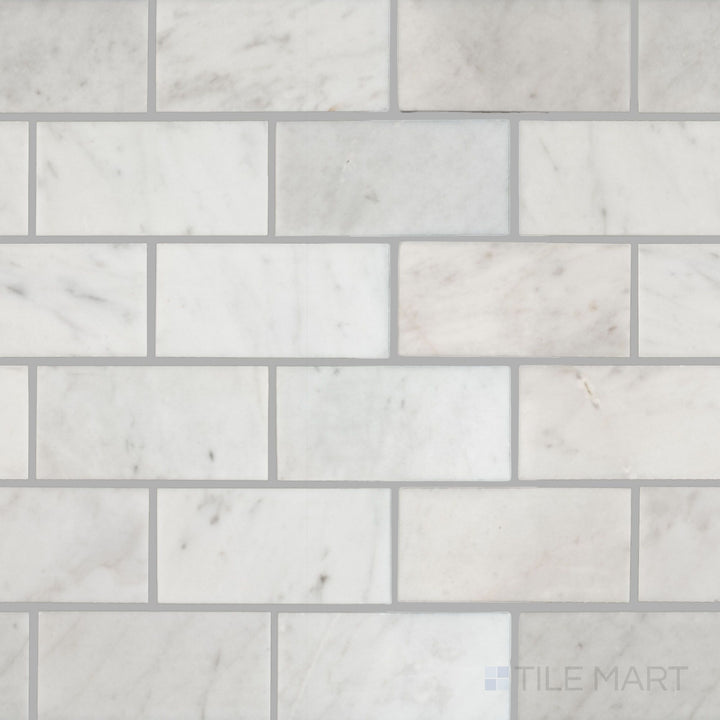 Flat overhead image of White Carrara Marble 2x4 brick polished mosaic, featuring bright glossy rectangles arranged in a classic stacked pattern