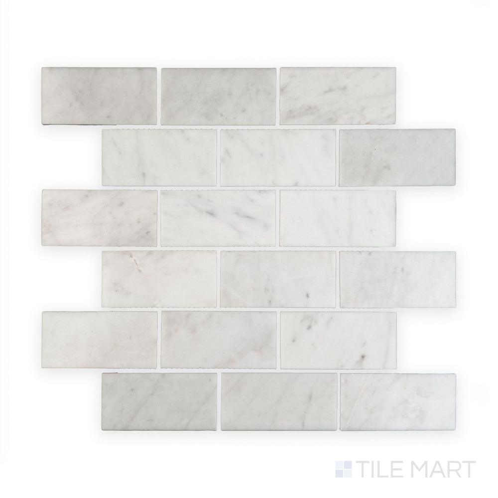 Tile showcase of White Carrara Marble 2x4 brick polished mosaic featuring glossy marble tiles arranged in a classic subway brick layout