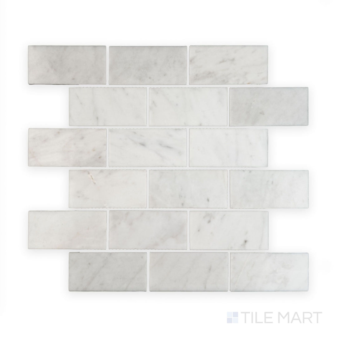 Tile showcase of White Carrara Marble 2x4 brick polished mosaic featuring glossy marble tiles arranged in a classic subway brick layout
