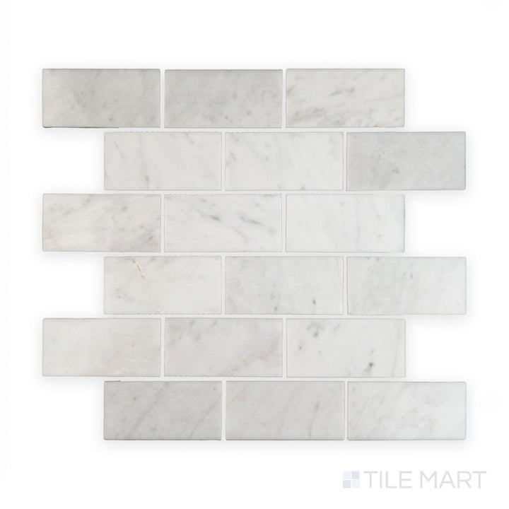 Tile showcase of White Carrara Marble 2x4 brick polished mosaic featuring glossy marble tiles arranged in a classic subway brick layout