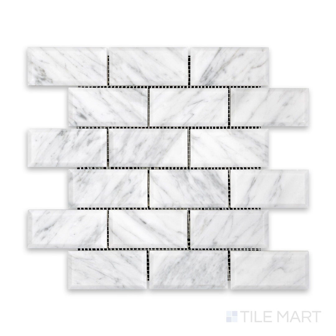 Tile arrangement of White Carrara Marble 2x4 brick beveled honed mosaic featuring matte marble tiles with crisp beveled edges in a classic layout