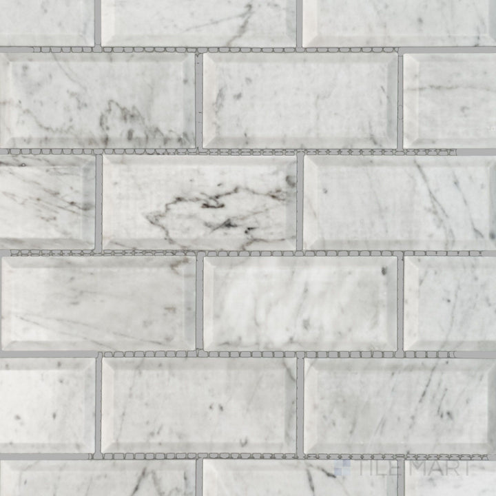 Top-down image of White Carrara Marble 2x4 brick beveled polished mosaic, featuring detailed beveled edges and a glossy reflective surface